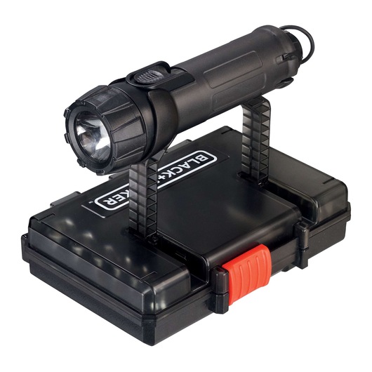 A BLACK+DECKER branded flashlight mounted on top of a black hard carrying case with a red latch.