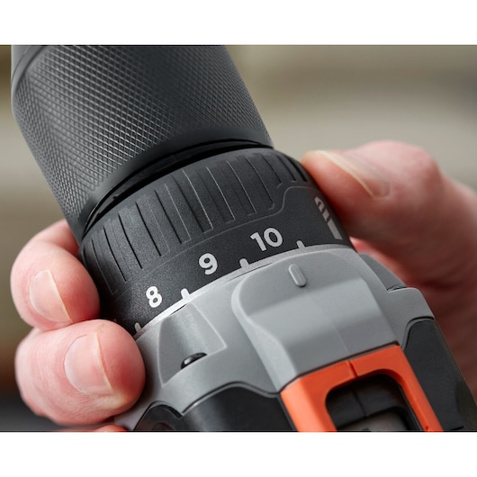 Close-up photo of BLACKDECKER BCD002ME2K cordless drill torque adjustment settings in hand.