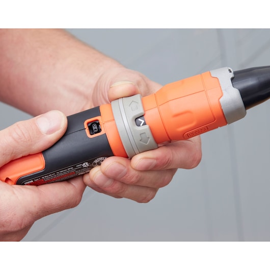 Photo of BLACKDECKER BCF602C cordless screwdriver close-up, orange and black, showing grip and control buttons.