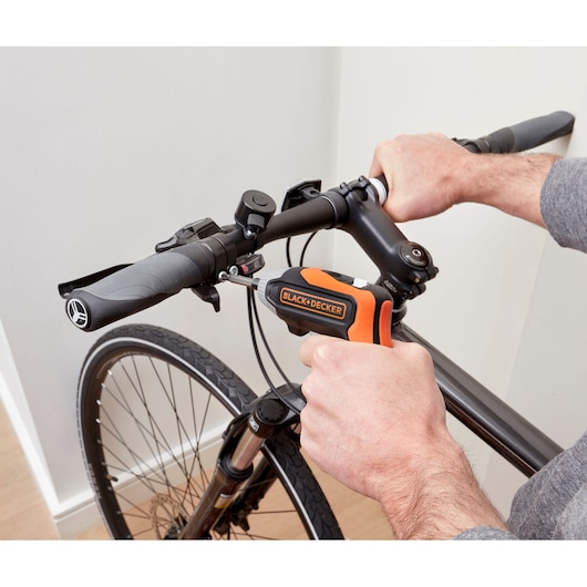 BLACK+DECKER BCF611CK cordless screwdriver used to tighten bike handlebar screw.