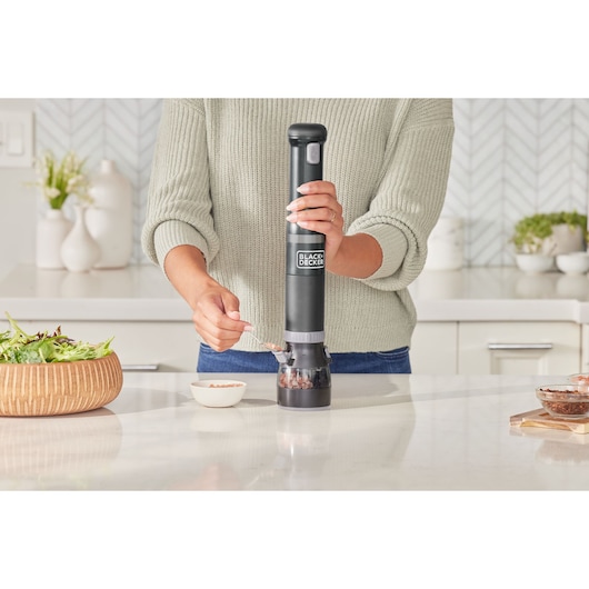 Photo of BLACKDECKER BCKM1012KB electric spice grinder in use on kitchen counter.