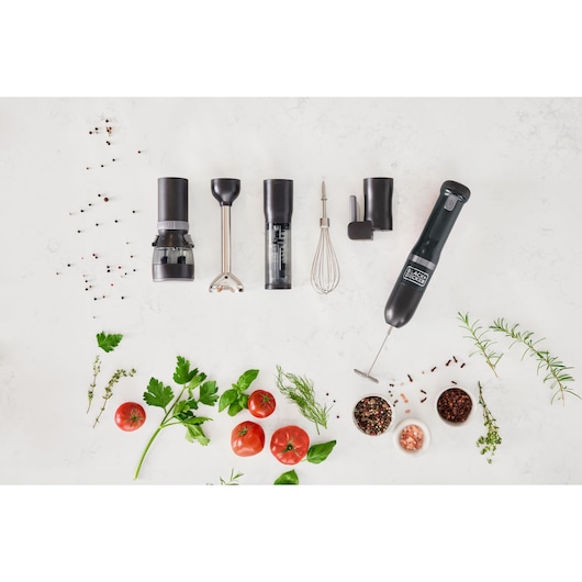BLACKDECKER BCKM1016KSB hand blender set with various attachments and accessories, top-down view with herbs and tomatoes.