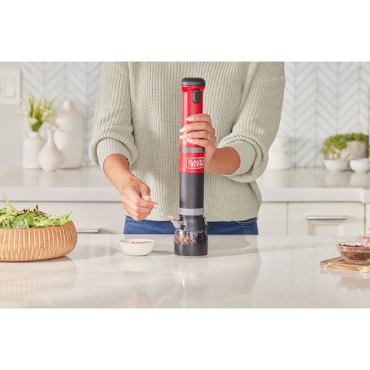 Photo of BLACKDECKER BCKM1016KSR electric pepper grinder in use on a kitchen counter.