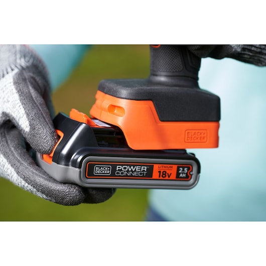 BLACKDECKER BCPP18D1 cordless tool with Power Connect 18V 2.5Ah lithium battery, close-up outdoors.