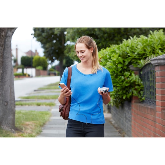 BLACKDECKER BDB12 photography of person in blue shirt carrying phone and small device outdoors.