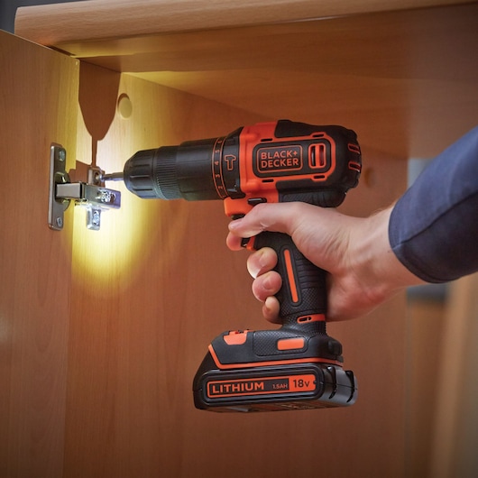 BLACKDECKER BDCHD18K cordless drill photography, 18V lithium, used for assembling cabinet hinge.