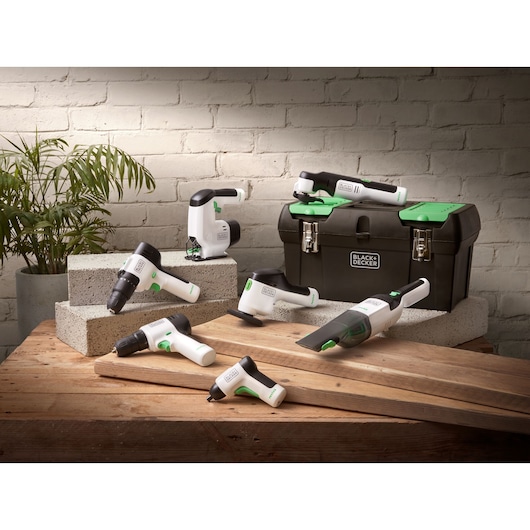 BLACKDECKER REVHV8J40 white and green cordless tool set with toolbox on wooden table.