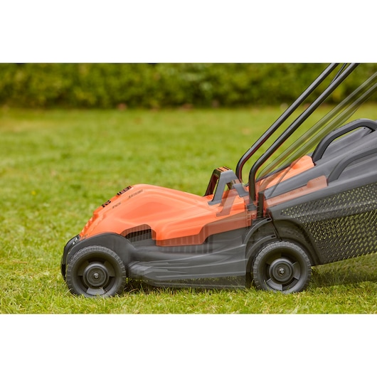 BLACKDECKER BEMW451 electric lawn mower side view on grass, showing adjustable handle positions.