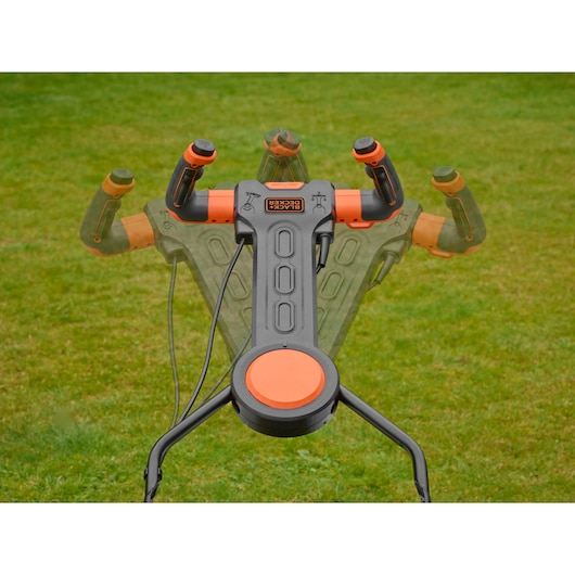 BLACKDECKER BEMW461ES lawn mower handle with multi-angle adjustment shown on grass.