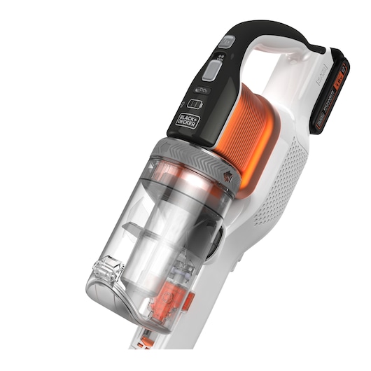 Close-up view of a BLACK+DECKER cordless handheld vacuum cleaner with a transparent dust container and orange filter, featuring control buttons on the handle.