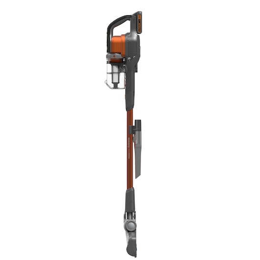 A BLACK+DECKER cordless stick vacuum cleaner, featuring an orange and grey design with a transparent dust container and a slim, upright profile.