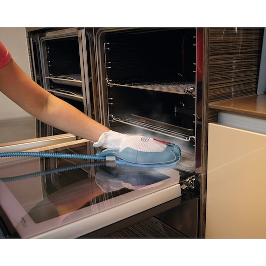 Photo of BLACK+DECKER BHSM1615DSG steam cleaning glove cleaning oven door glass.