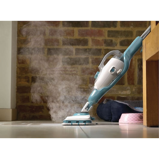 BLACKDECKER BHSM168DSM steam mop cleaning tiled floor near pet bowl, side view.
