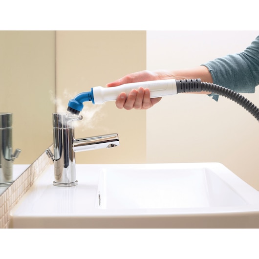 BLACKDECKER BHSM168U steam cleaner nozzle cleaning chrome faucet in bathroom.