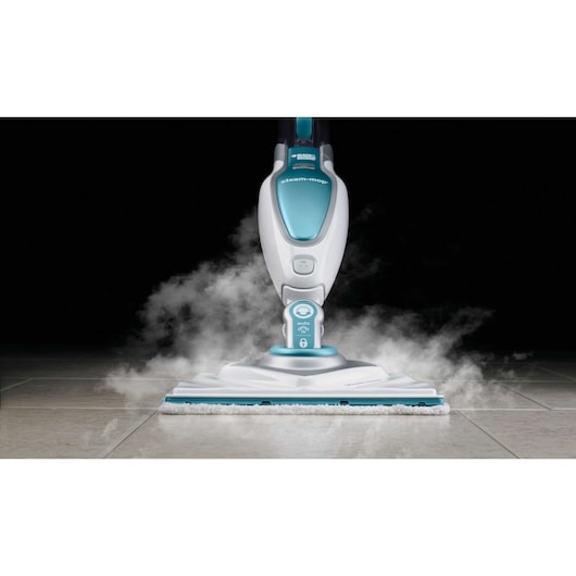 BLACKDECKER FSM1630 steam-mop cleaning tile floor, front angle with visible steam.