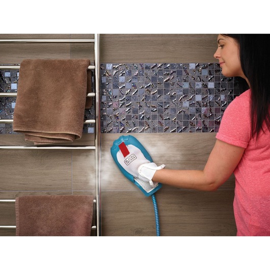 BLACKDECKER FSMH1321JSM steam cleaning mitt used on tiled wall in bathroom setting.