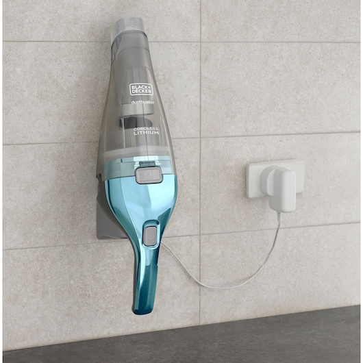 BLACK+DECKER NVC220WBC handheld vacuum with blue handle mounted on wall charger, front angle.