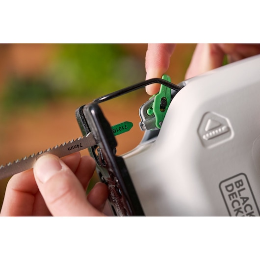 Photo of BLACK+DECKER REVJ12C jigsaw close-up, showing blade being inserted into the tool.